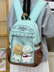 Zaino giapponese a pois con tasca frontale trasparente e morbidi ciondoli di peluche per la scuola.