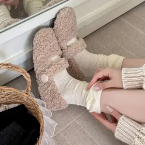 Fluffy sherpa Mary Jane shoes paired with cozy pearl lace ruffle mid-calf slouch socks.