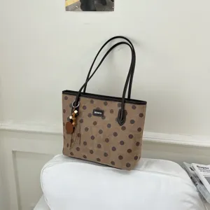 Brown polka dot tote bag detailed view, large capacity commuting handbag with stylish charms.