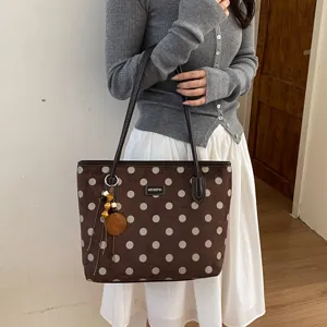 Brown polka dot tote bag large capacity commuter handbag with cute pendant decoration.
