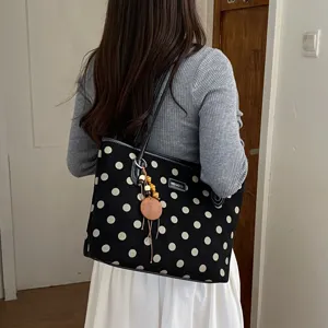 Fashionable black and white polka dot canvas tote bag, large capacity shoulder handbag.