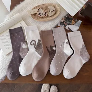 Cute flocked big tail cat women's mid-tube cotton socks with playful polka dot design.