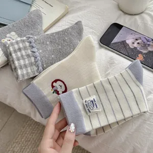 Cozy women's crew socks featuring cute embroidered puppy designs, ruffles, and vintage plaid styles.
