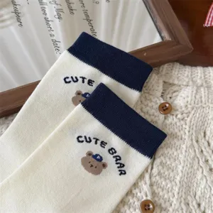 Cute Japanese style navy blue cuff crew socks with cartoon bear embroidery for women.