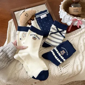 Detailed view of Japanese navy cute bear socks, cotton knit college style mid tube design.