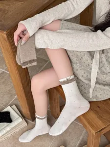 Japanese sweet polka dot mid-tube socks with cute bow lace cuff for women daily wear.