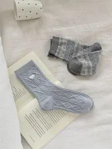 Comfortable mid-tube women socks with retro patterns, stylish light blue casual daily wear.