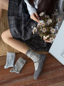 Cozy knit mid-calf socks detailed with vintage Fair Isle patterns for daily winter styling.