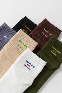 Men's cotton ankle socks featuring stylish quote embroidery in multiple versatile colors.