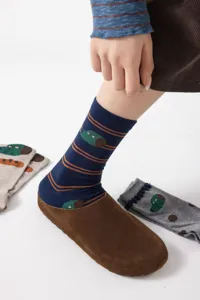 Detail shot of cute cartoon design cotton crew socks with colorful stripes for women.