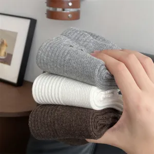Comfortable cotton mid-tube socks in grey white and brown. Soft ribbed knit daily wear.