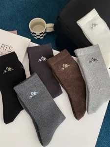 Men's casual cotton mid-calf socks featuring stylish snow mountain embroidery for street style daily wear.