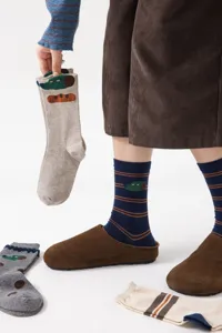 Cozy cotton mid-tube socks with cute cartoon dog patterns and retro stripes for daily wear.