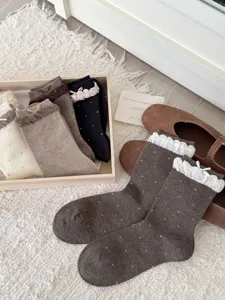 Sweet Japanese polka dot lace mid-tube socks detail, featuring cute bows and ruffled bubble cuffs.