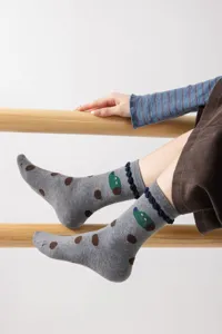 Cute cartoon women's mid-tube socks with cute animal illustration and cozy cotton fabric.