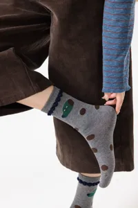 Cute cartoon printed women's mid-calf cotton socks with playful polka dots and ruffled cuffs.