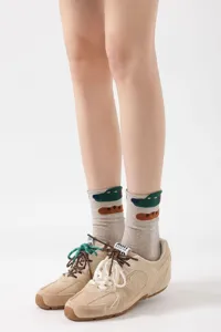 Cute cartoon dog print cotton mid-tube socks for women, comfortable and artistic style.