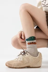 Detail shot of cartoon design cotton socks, showcasing the unique artistic pattern and comfortable fit.