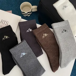 Men's casual ribbed mid-tube cotton socks featuring stylish snow mountain embroidery design.