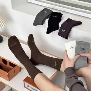 Men's casual cotton mid-calf socks featuring trendy snow mountain patterns for daily wear.
