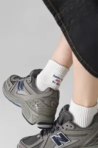 Detail shot of men's cotton short socks featuring stylish English letter embroidery.