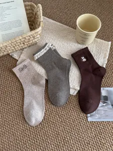 Sweet Japanese style cotton mid-tube socks set with lace, bow, and cute rabbit embroidery details.