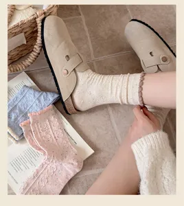 Women cozy cable knit mid-tube socks with cute ruffle edge and stylish speckle yarn design.