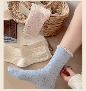 Korean style speckled yarn women mid-calf socks with cute ruffles and cozy cable knit design.
