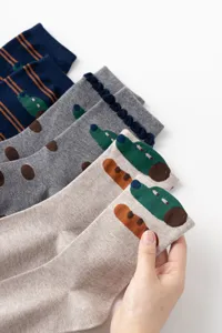 Original cartoon design mid-calf cotton socks with cute patterns, comfortable knit style.