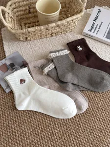 Sweet cute cotton socks with lace ruffles and cute embroidery mid-tube designs for daily wear.