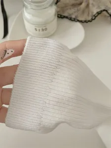 White ribbed knit long socks for women, fine striped cotton tube socks detail view.