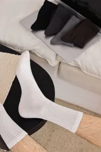 Detail shot of men's breathable cotton ribbed crew socks, comfortable daily wear.