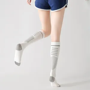 Calze a compressione sportive da donna a righe traspiranti lunghe calze da corsa e fitness