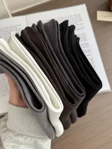 Detailed view of men's solid color mid-calf cotton socks in multiple classic colors.