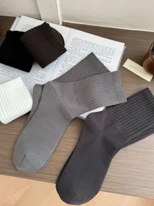 Detailed shot of classic ribbed cotton crew socks showcasing fine texture and colors.
