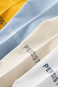 Men sports cotton mid tube socks detail shot showing colorful stacked design with woven text.