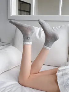 Women light grey mesh mid-tube socks detail with cute bear design and polka dot ruffles for summer.