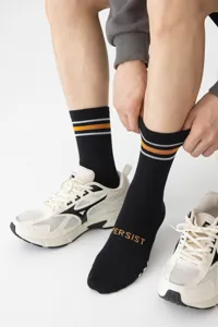 Men's athletic mid-tube socks detail, featuring two-tone color-blocking stripes and contrast lettering.
