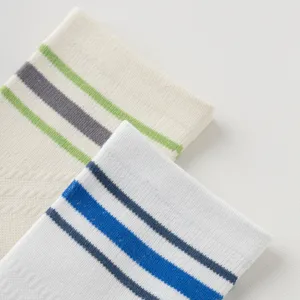 Men's athletic sports socks detail view featuring classic two-bar color-blocked ribbed cuff.