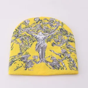 Yellow knit beanie with Y2K gothic human portrait graphic. Warm winter streetwear cap.