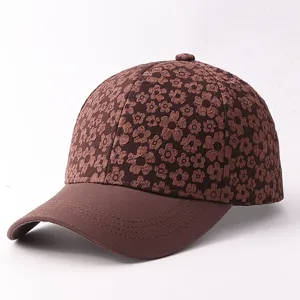 Detail shot showing the brown floral textured crown and stitched brim of the stylish cap.