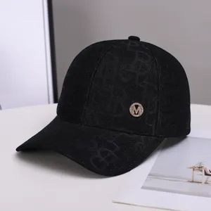 Stylish black rhinestone M logo baseball cap with subtle monogram print for daily sun protection wear