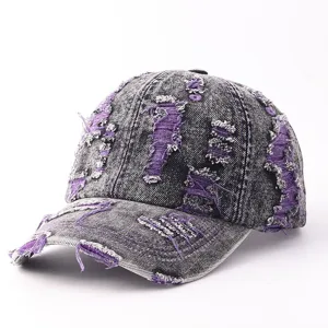 Distressed purple denim baseball hat close-up showing unique ripped texture and vintage style.