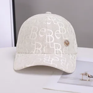 Stylish monogram baseball cap for women, breathable woven sun hat with rhinestone metal logo.