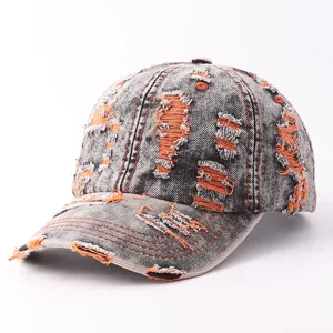 Distressed denim baseball cap with orange ripped details, vintage retro fashion streetwear hat.