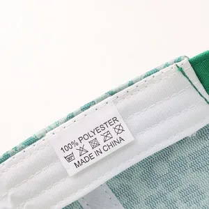 Close-up detail shot of the interior wash care label inside the trendy floral baseball cap.