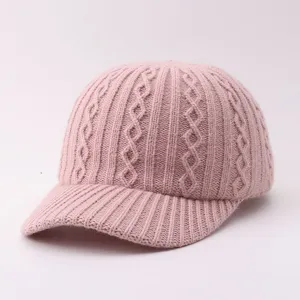 Pink knit baseball cap with cable texture. Soft warm winter hat for women, casual duckbill style daily wear.