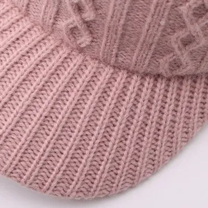 Detailed view of the pink knitted baseball cap showing fine texture, warm and cozy winter hat.