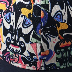 Detailed view of a trendy national style facial makeup print baseball cap with colorful artistic patterns.
