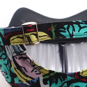 Detailed view of the adjustable metal buckle and colorful printed strap on the stylish baseball cap.